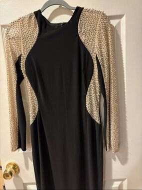 Xscape Black Gown with Pearl-Studded Nude Illusion Sleeves